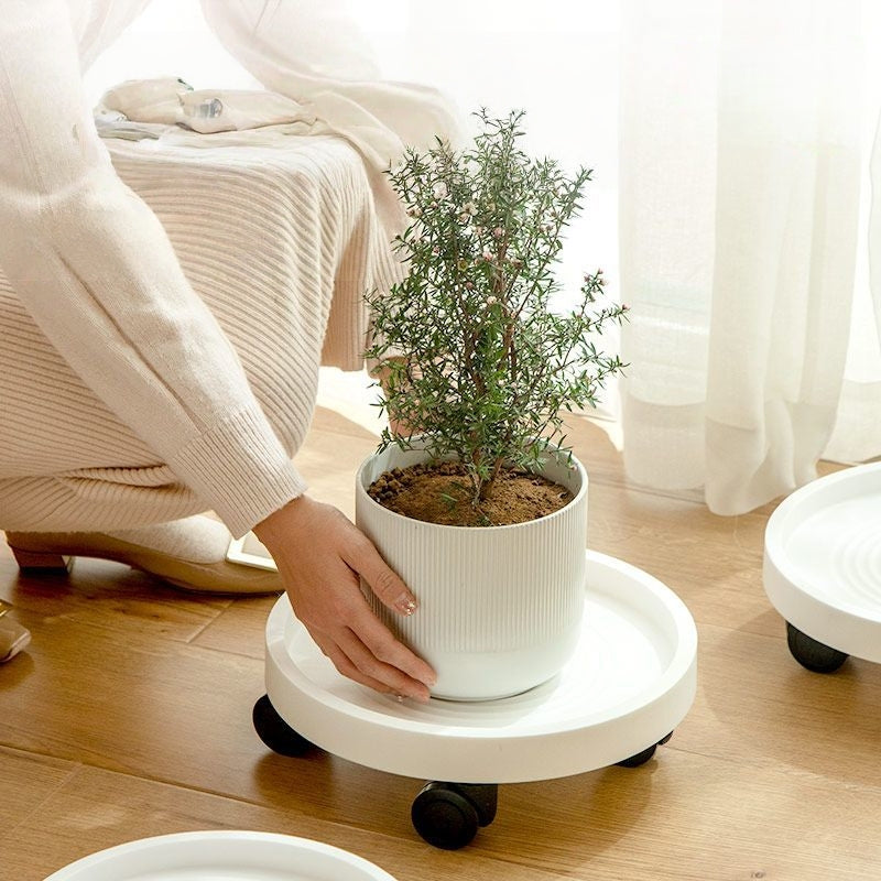 Minimalistiskt Krukunderlägg med Hjul – Flytta dina växter smidigt & tyst!
